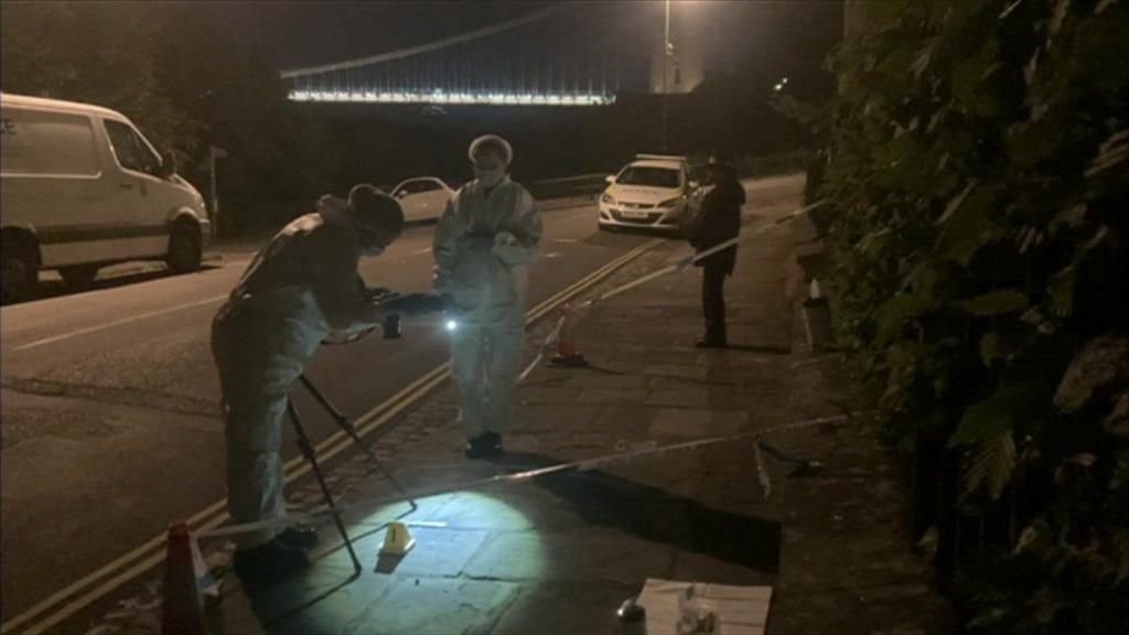 People in white suits examining potential evidence in Sion Hill