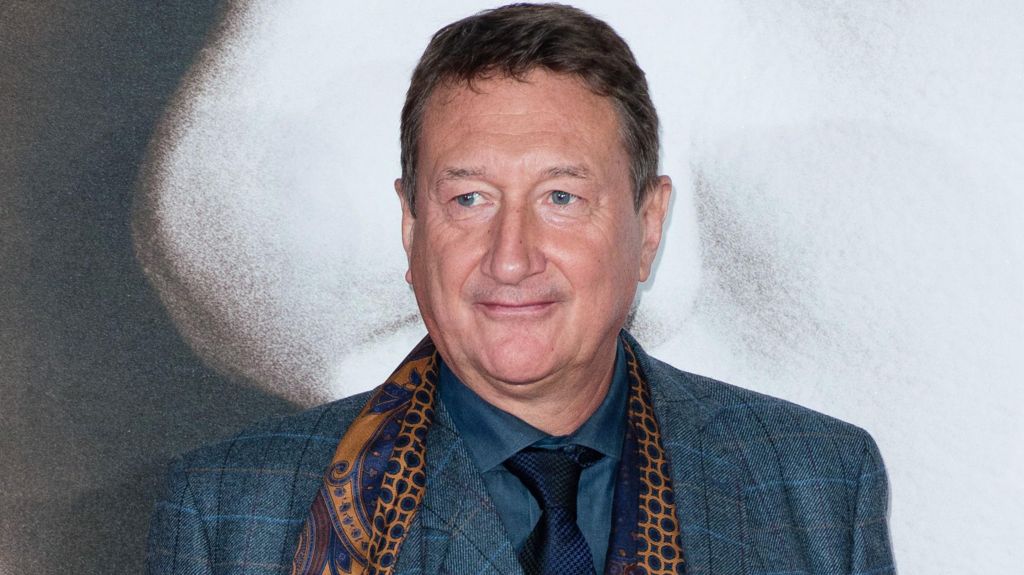 Steven Knight in a smart suit and scarf