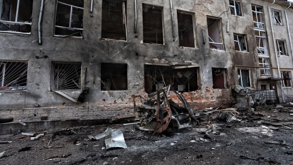 This photograph taken on 16 August, 2024, during a media tour organised by Ukraine, shows a destroyed vehicle next to a destroyed building in the Ukrainian-controlled Russian town of Sudzha, Kursk region, amid the Russian invasion in Ukraine.