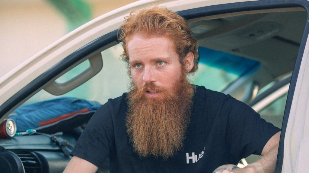 Russell Cook sat in his support vehicle in Ivory Coast