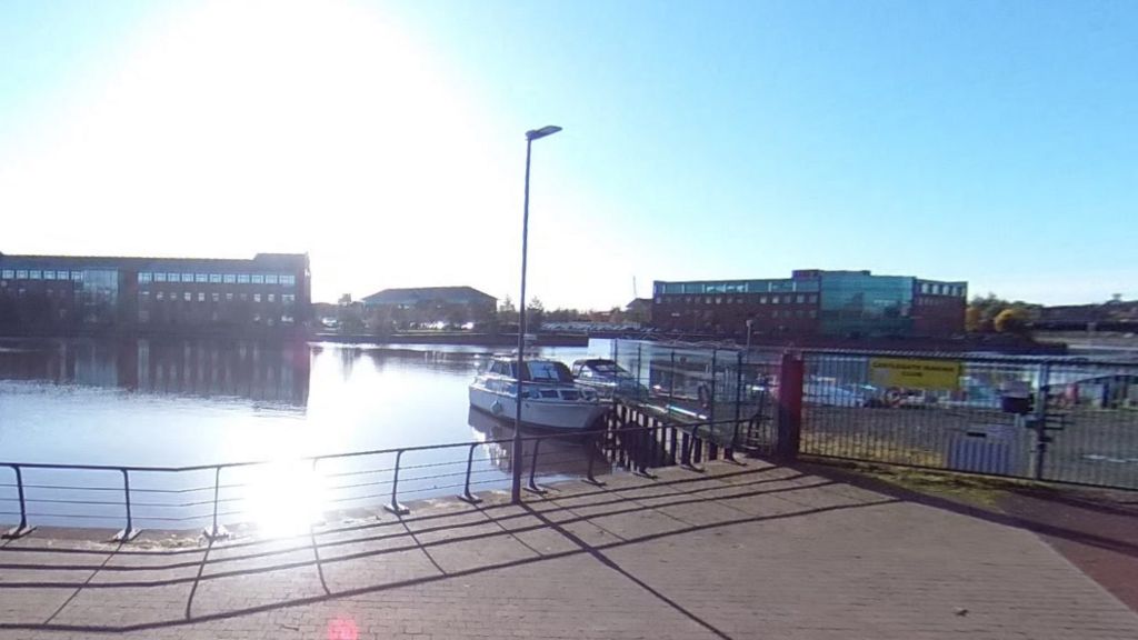 Castlegate Marine Club gates opening onto a collection of boats in the River Tees.