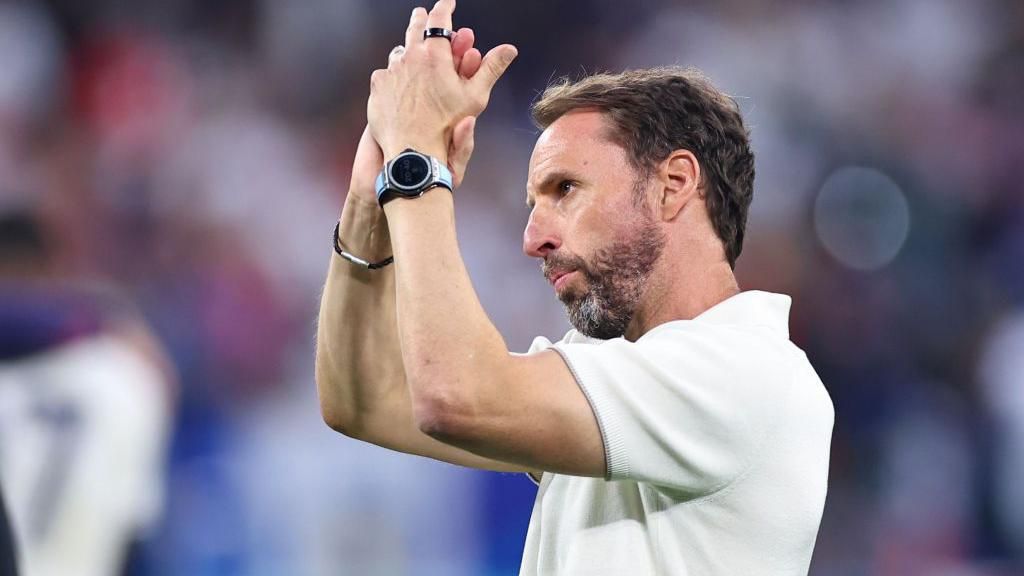 Gareth Southgate applauds fans during England's game with Slovakia