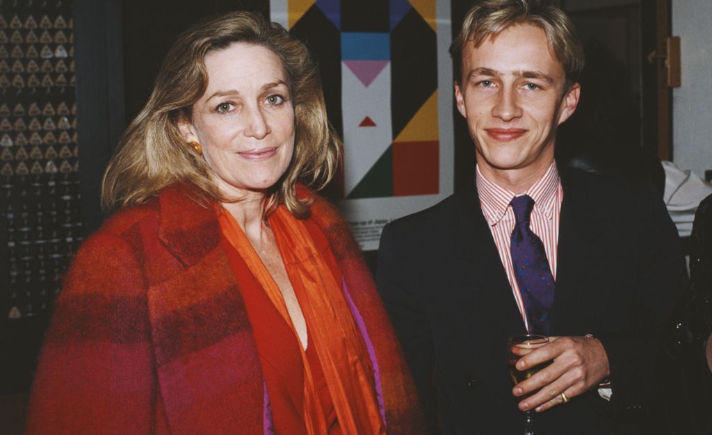 British author and journalist Shirley Conran, left, stands with her son British designer Jasper Conran, whilst attending Japanese fashion designer Issey Miyake's exhibition 'Bodyworks' at the Boilerhouse project in the Victoria & Albert Museum