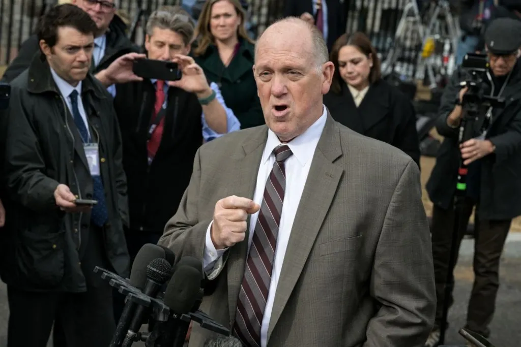 Tom Homan dressed in a suit speaks to reporters outside the White House