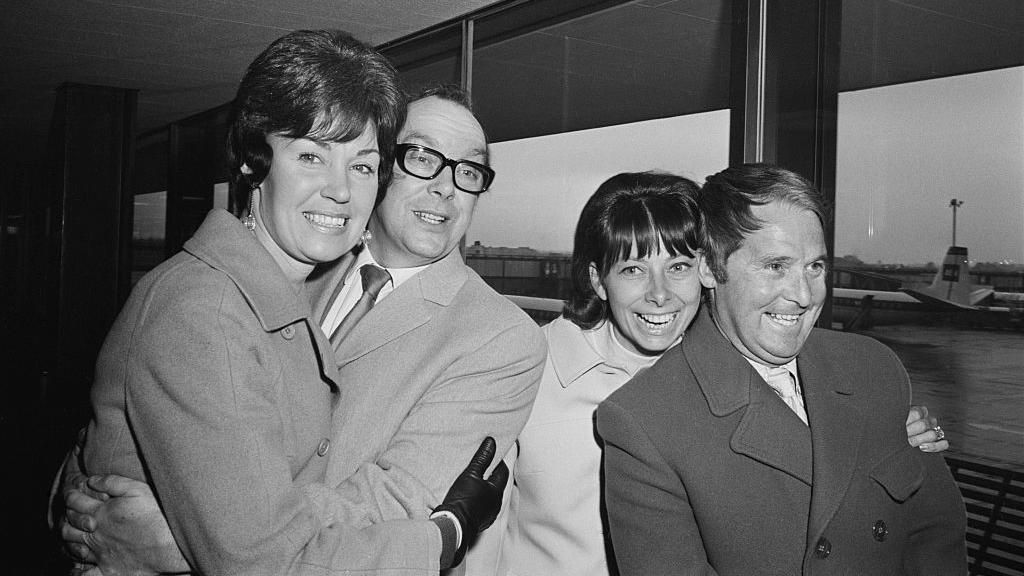 Eric Morecambe and Ernie Wise with their wives Joan and Doreen