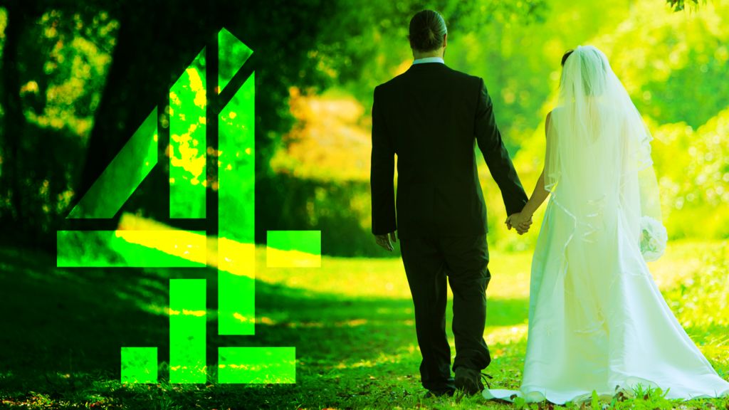 A groom dressed in a dark suit and a bride dressed in white walk hand in hand along a sunlit grassy path, surrounded by tall green trees. Bright sunlight filters through the leaves. A large green Channel 4 logo sits to the left.