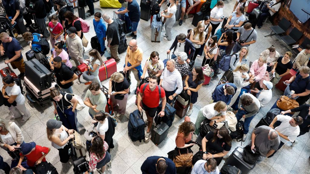 A group of people waiting at Eindhoven Airport