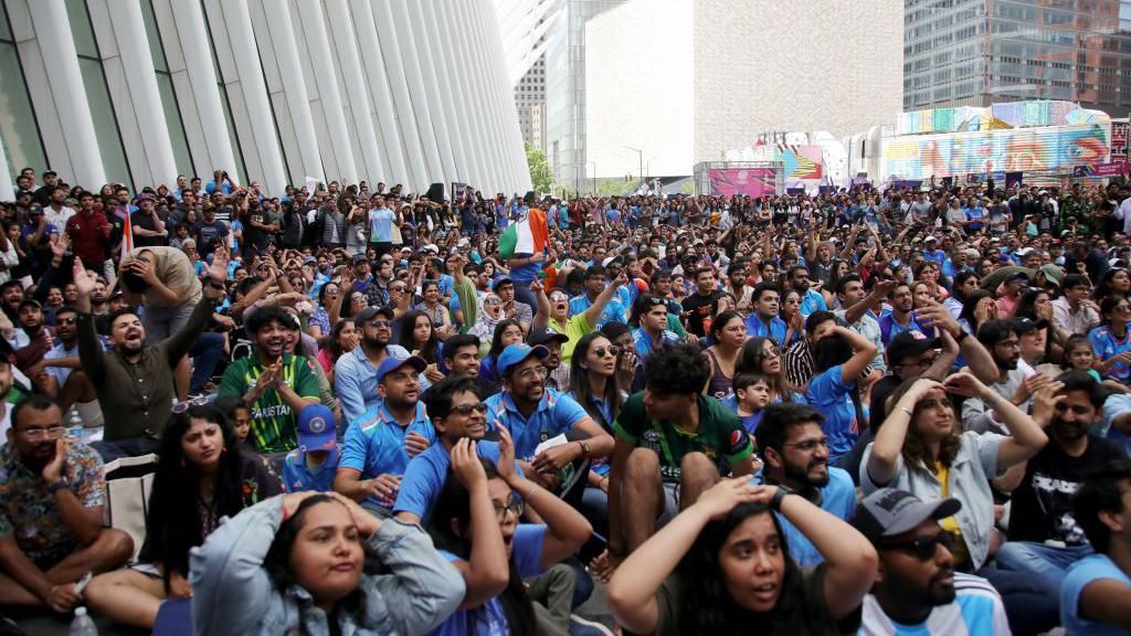 Fans watch Pakistan v India at the T20 World Cup on a big screen at the Oculus building in lower Manhattan