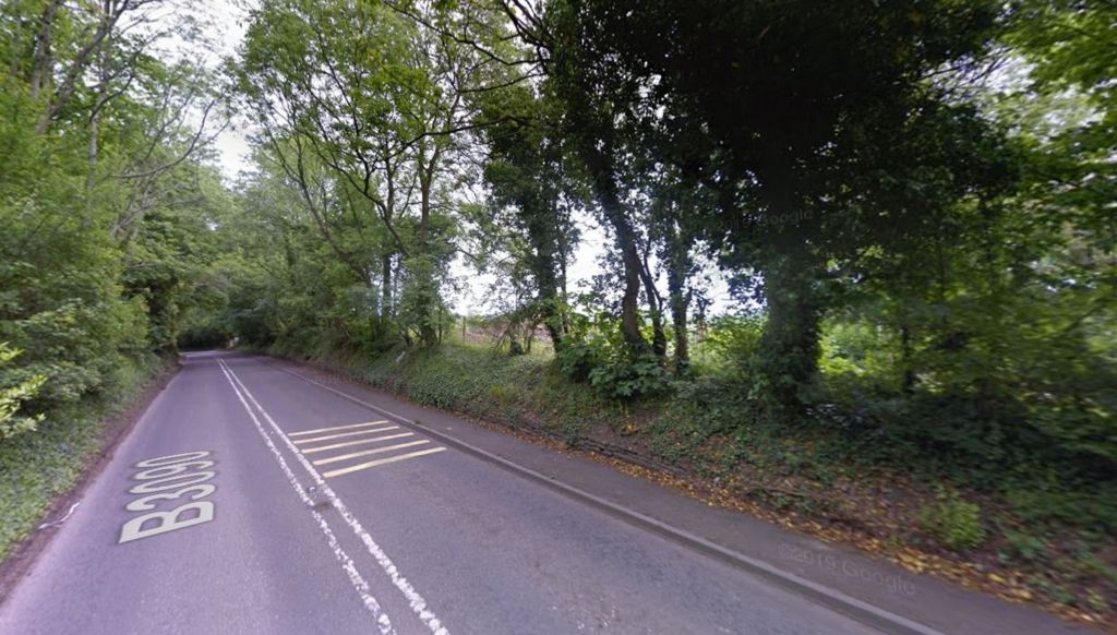 An image take from Google Maps showing the tree-lined B3090 Oldford Hill just to the north of Gypsy Lane where a new junction would give access to the housing development