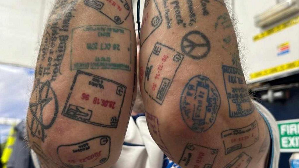 Ian Odgers tattoos of passport stamps