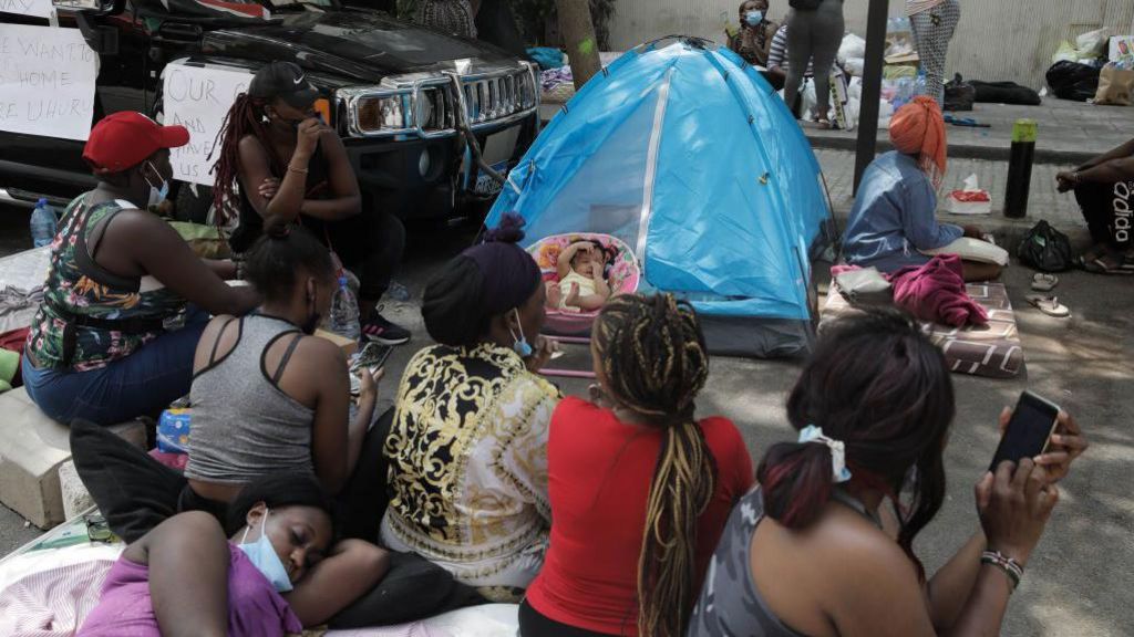 Migrant workers from Kenya block the street during the sit-in demanding their repatriation outside the Kenyan consulate on August 13, 2020 in Beirut, Lebanon