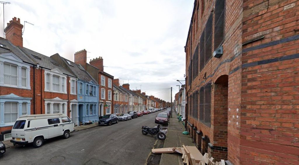 Colwyn Road - a terraced residential street with a factory in the foreground