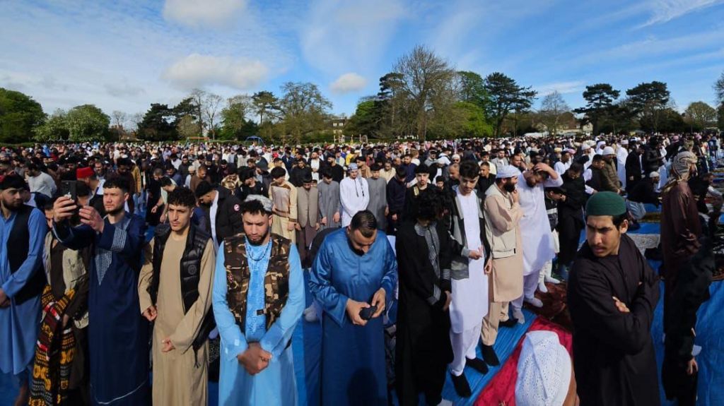A congregation of Muslims in a Peterborough park