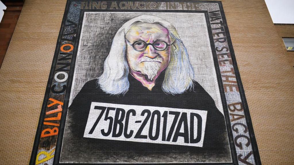 The mural of Billy Connolly on the side of the building