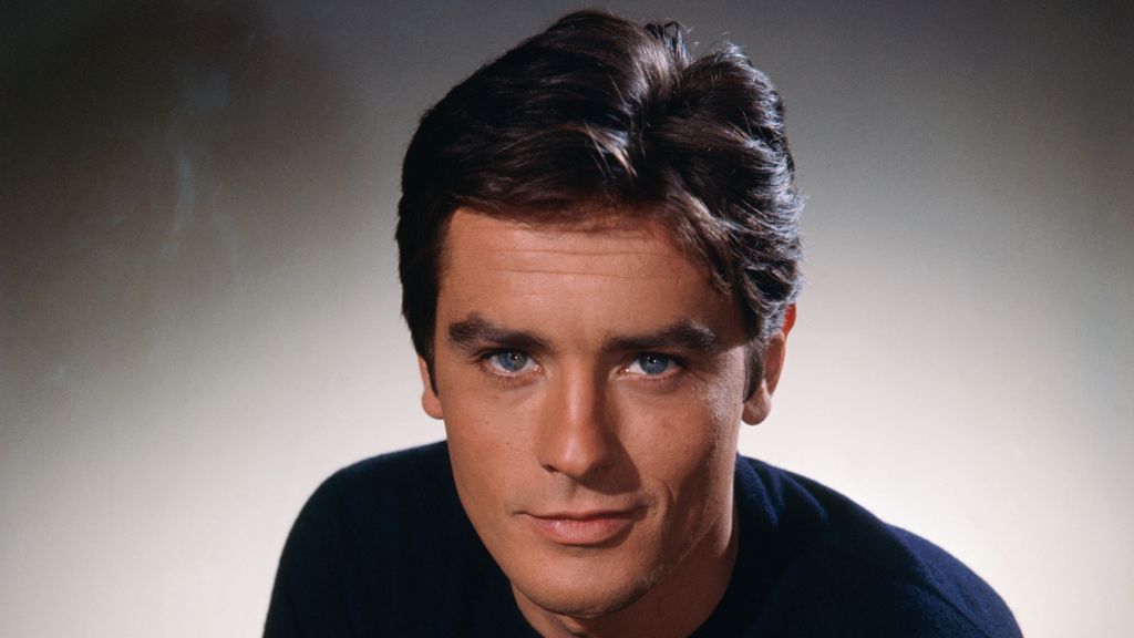 Head and shoulders portrait photo of French actor Alain Delon taken during the 1960s