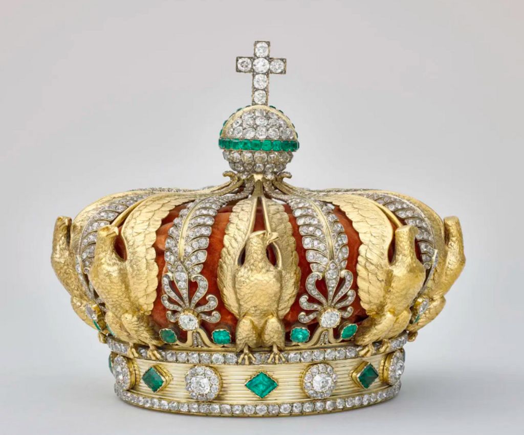 A gold crown adorned with diamonds, green emeralds and eagles moulded from gold which was taken from the Louvre Museum