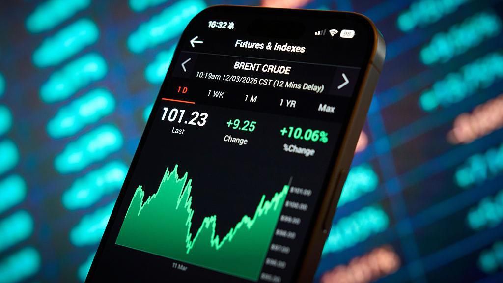 Oil prices are seen displayed on a mobile device