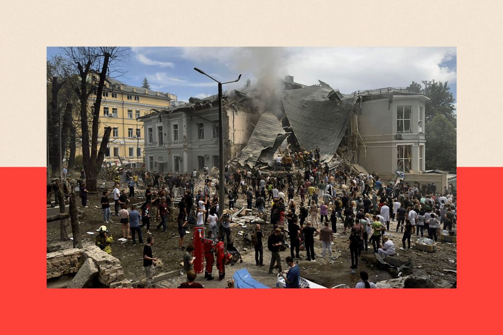 Rescuers clear the rubble of the destroyed Ohmatdyt Children's Hospital following a missile attack in Kyiv