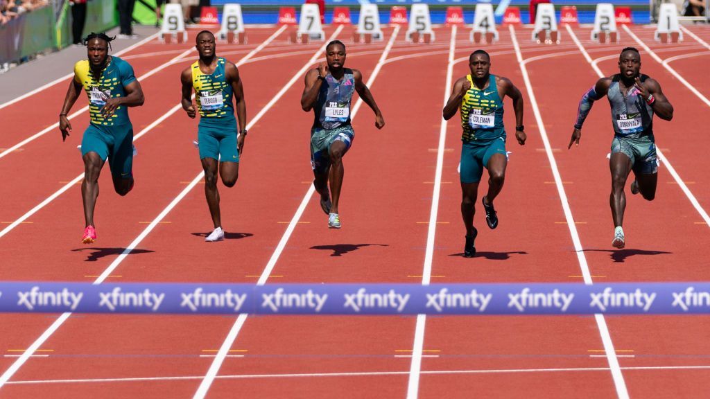Kishane Thompson and a group of Jamaican runners competing in the 100m