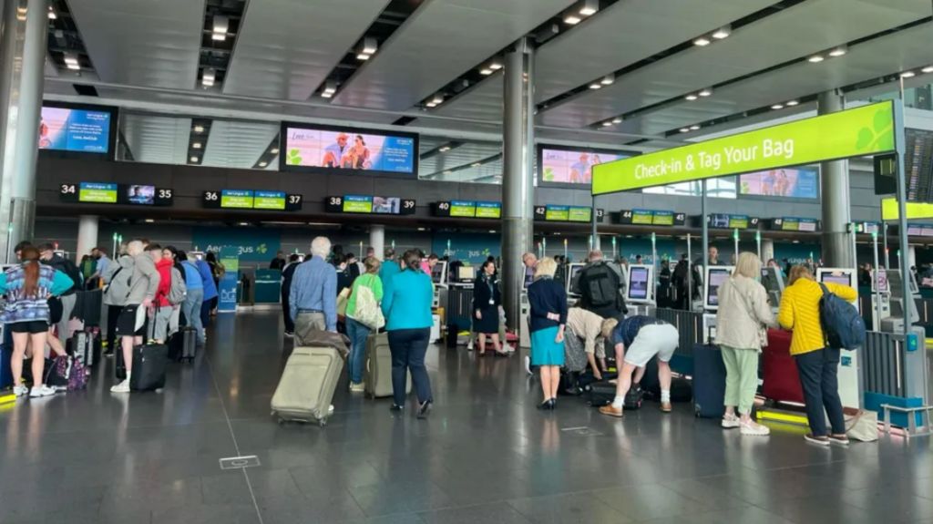 Dozens of passengers at the bag drop area of Dublin Airport's Terminal 2