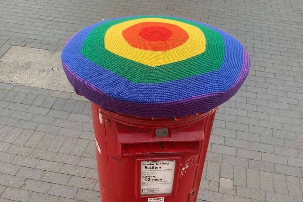 Post box with rainbow topper