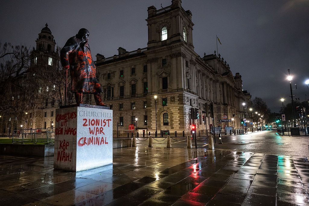 The Churchill statue, in Parliament Square, seen vandalisedwith red paint and pro-Palestine slogans including "Zionist war criminal"