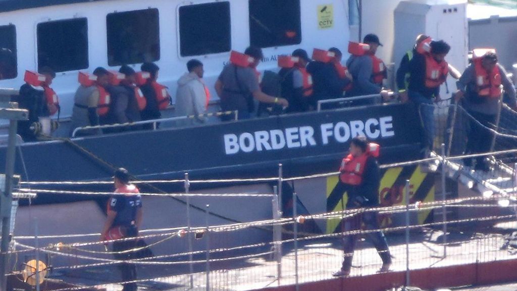 Migrants arriving at Dover after crossing the English Channel.