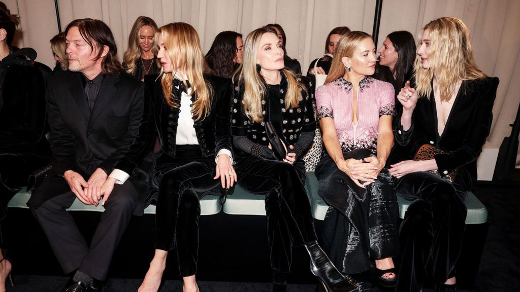 Norman Reedus, Diane Kruger, Michelle Pfeiffer, Kate Hudson and Elizabeth Debicki sit side-by-side - Hudson and Debicki are talking, while the others look off to the side. All are wearing black or black-and-white outfits, while Hudson wears a pale pink embellished top