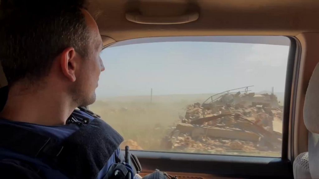 Hugo Bachega looking out of a window in a car