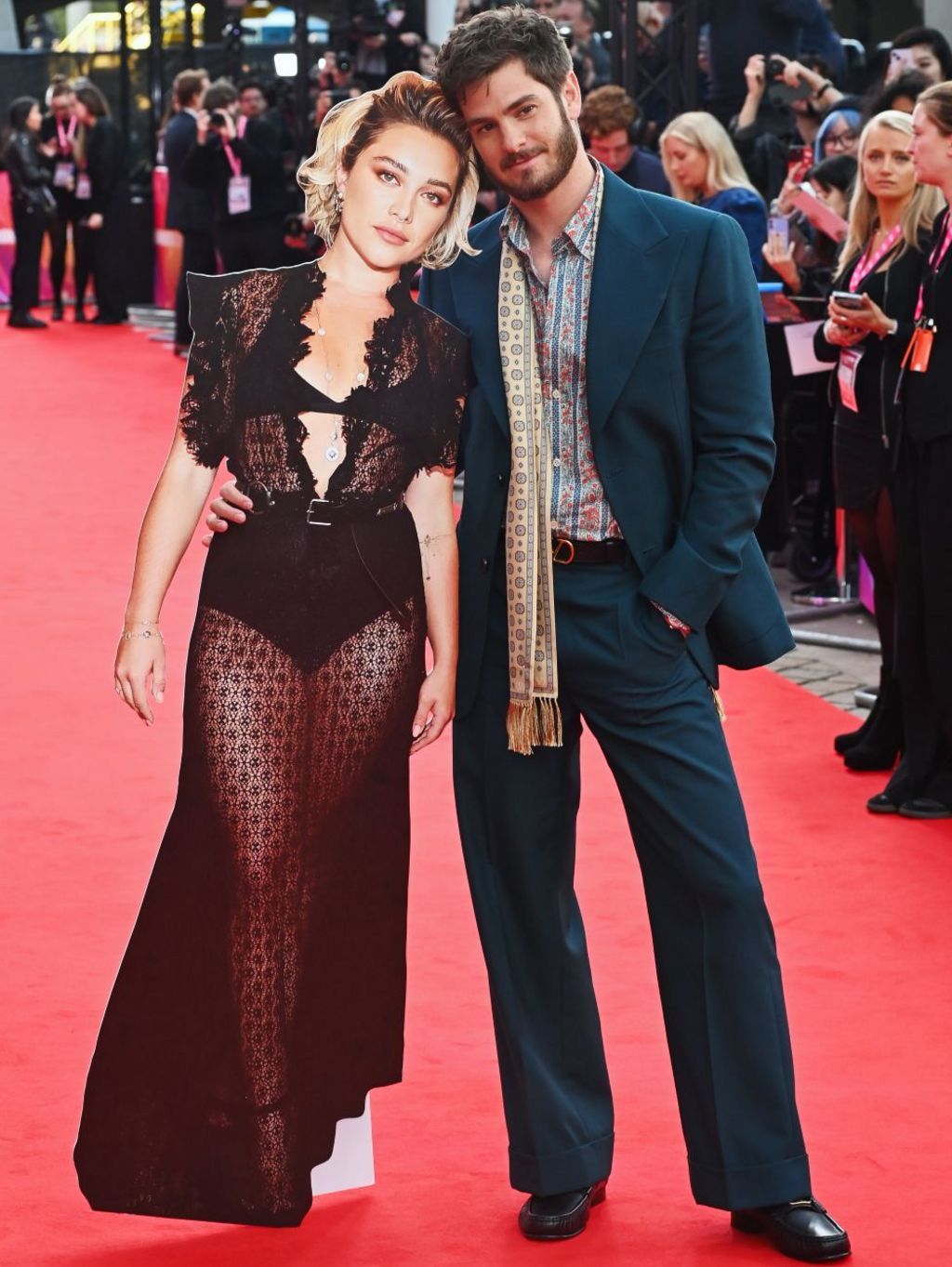 Andrew Garfield (R) poses with a cardboard cutout of Florence Pugh at the Headline Gala screening of "We Live In Time" during the 68th BFI London Film Festival at The Royal Festival Hall on October 16, 2024 in London, England