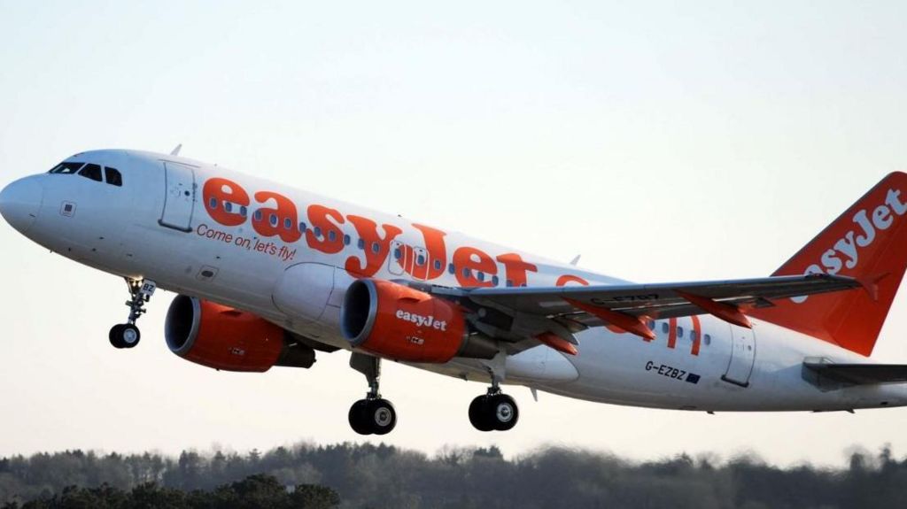 An easyjet airline takes off with its undercarriage down