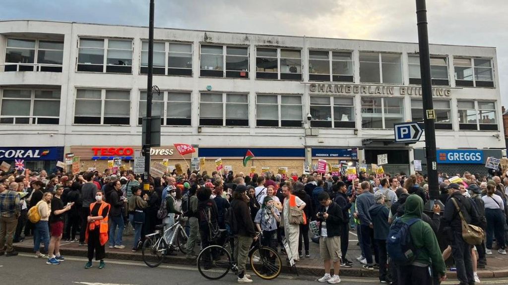 People gather ahead of an anti-immigration protest in Birmingham