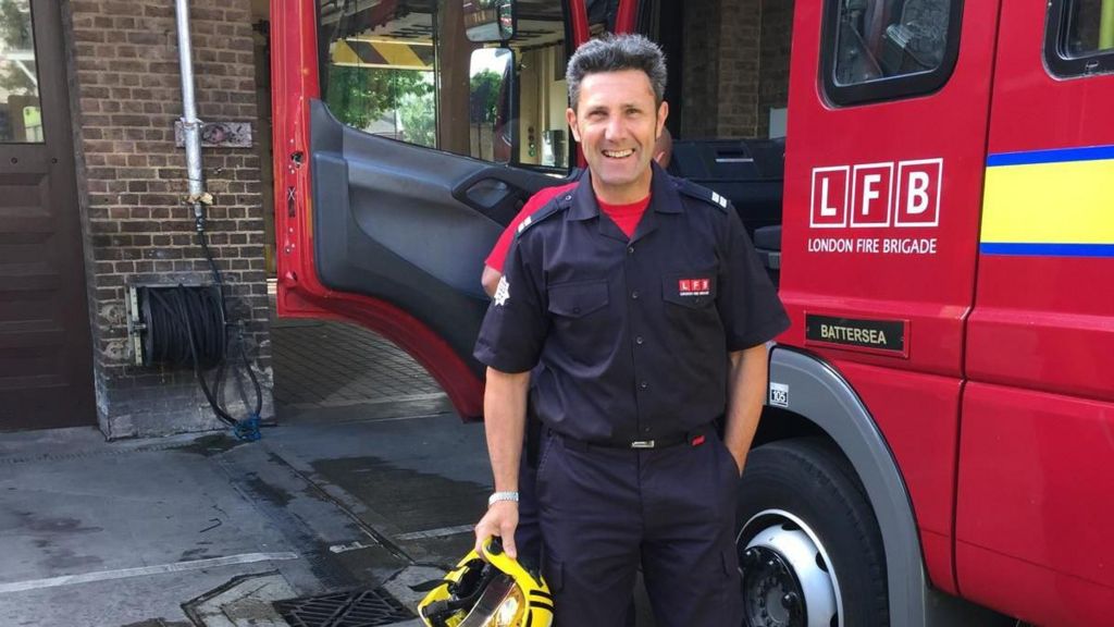 Aldo Diana is pictured next to a fire engine. 