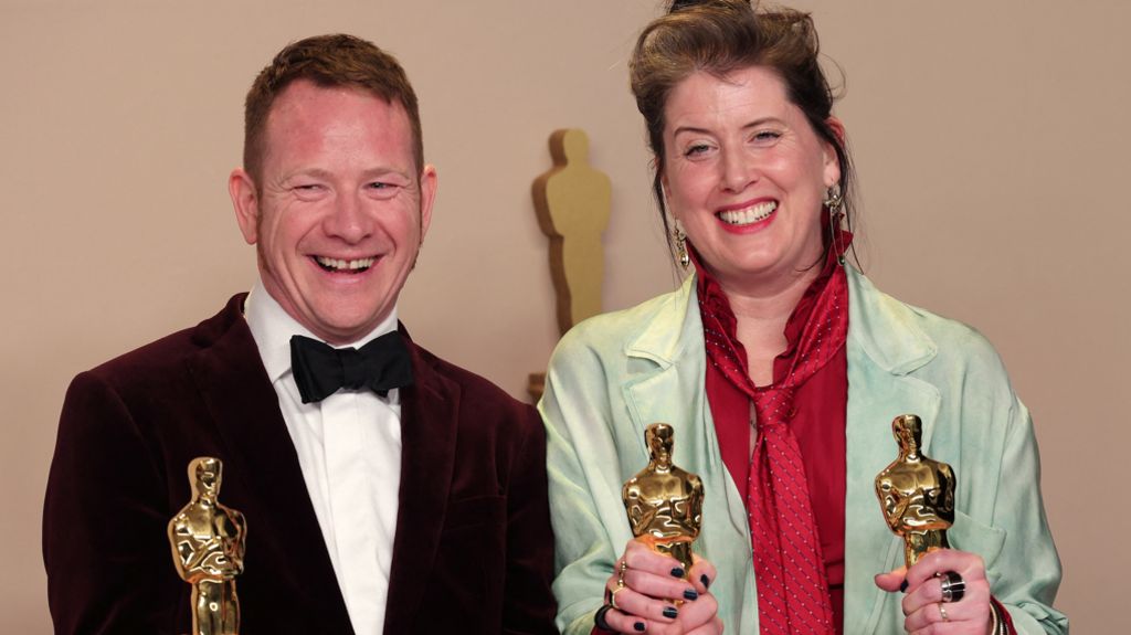 James Price and Shona Heath holding their Oscars