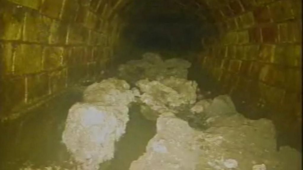 A blockage believed to weigh around 100 tonnes which has been discovered in the sewers in Whitechapel, east London. Lumps of a white fatty substance sits at the bottom of a bricked tunnel
