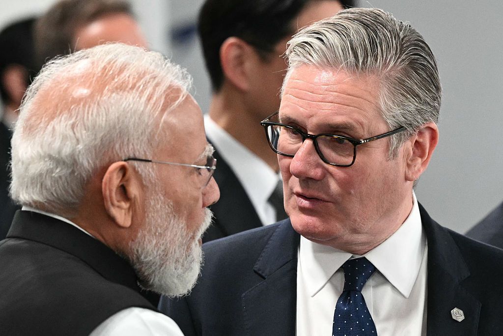 India's Prime Minister Narendra Modi (L) speaks with Britain's Prime Minister Keir Starmer ahead of a morning work meeting to "revive balanced, inclusive, and sustainable economic growth for the benefit of all" in the presence of the G7 countries, partner countries, the International Monetary Fund, and the OECD, as part of the G7 summit, in Evian, eastern France, on June 17, 2026.