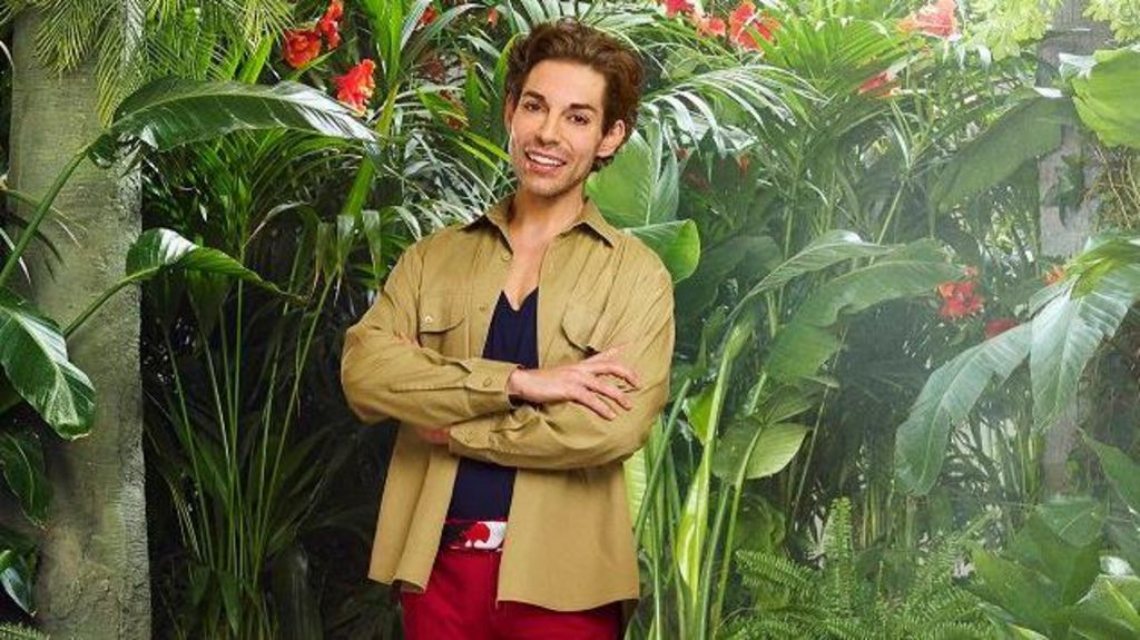 Tom Read Wilson wears a green khaki shirt.