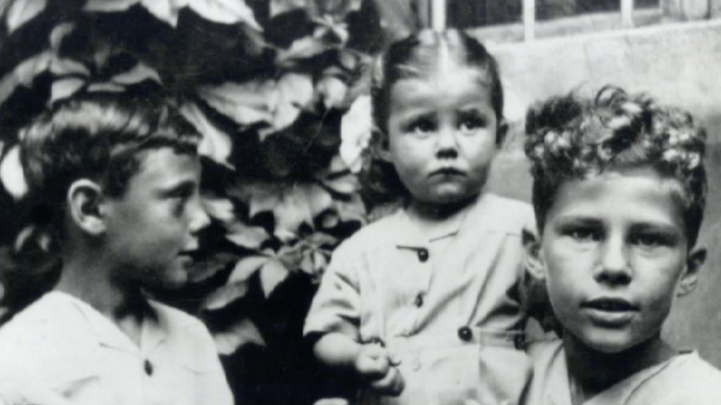 Giorgio Armani (left) with childhood friends during World War II in Italy