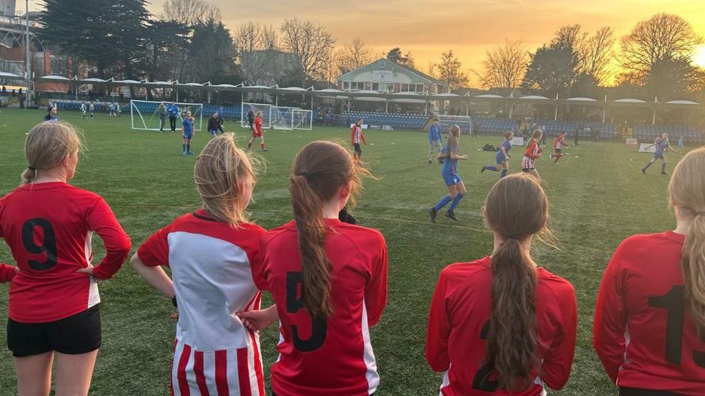 Girls watching the girls football