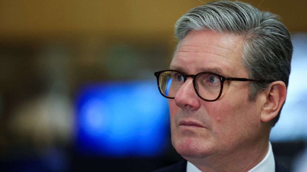 Prime Minister Sir Keir Starmer looks on at a Met Police special operations room at Lambeth palace