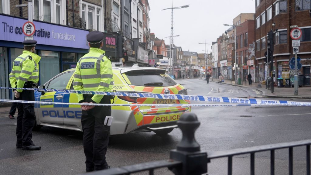 Street scene with police and a taped-off road