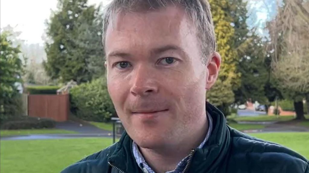 Bradley Thomas stands in a local park. 