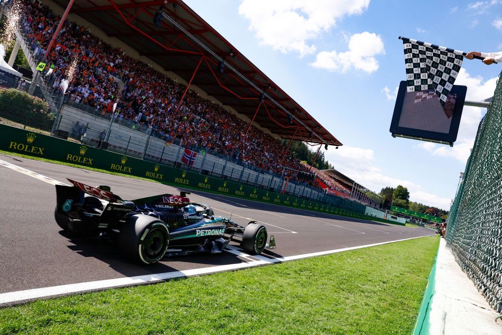 George Russell crosses the finish line to win