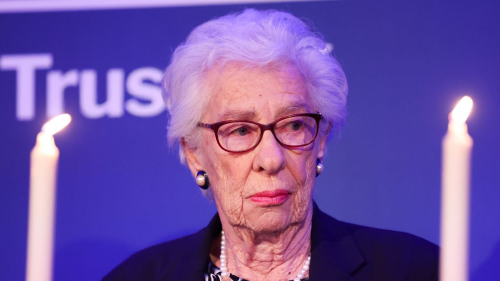 Eva Schloss MBE, step-sister of Anne Frank and Honorary President of the Anne Frank Trust UK takes part in a candle lighting ceremony during a reception to mark Holocaust memorial day