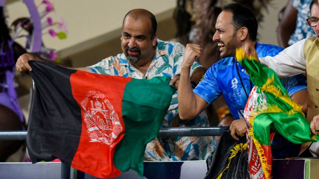 Fans cheer on Afghanistan's cricket team as they beat Australia 