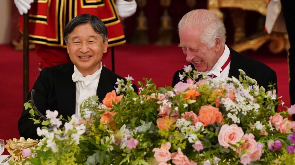 King Charles talks with Emperor Naruhito of Japan during the State Banquet at Buckingham Palace.