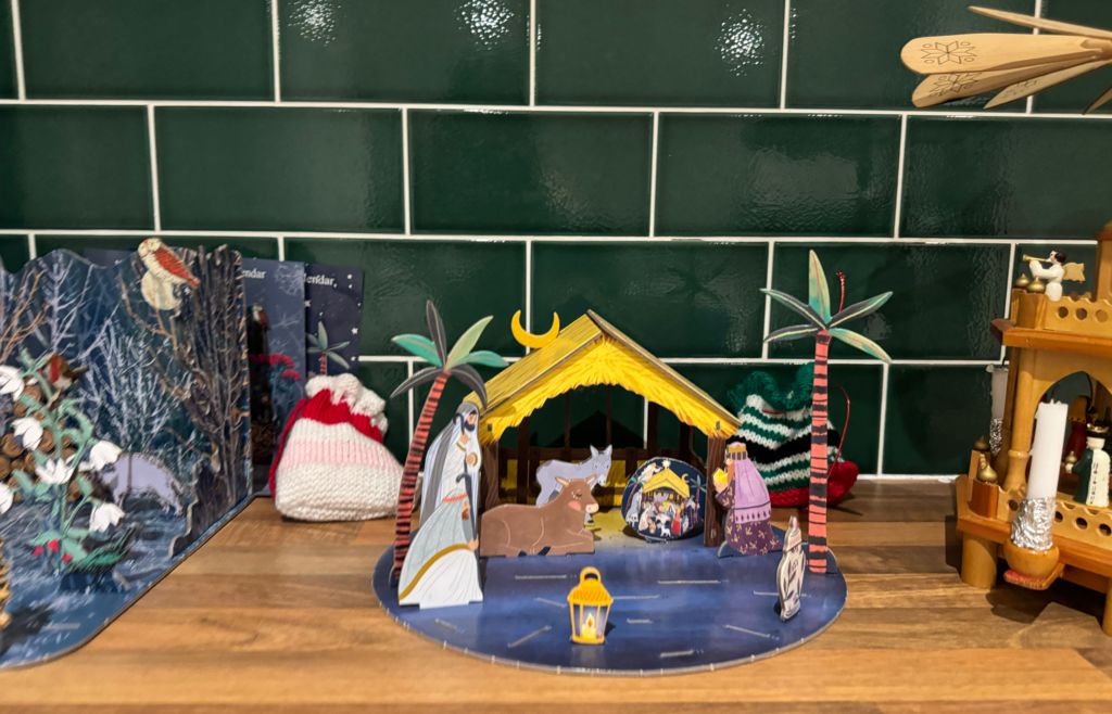 The nativity scene shows a shepherds, wise men and animals in a barn