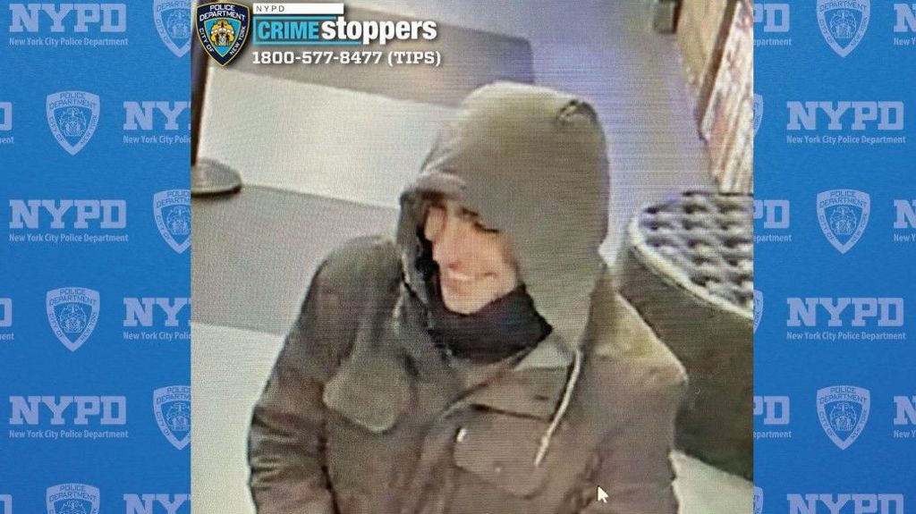 NYPD-released image of an unmasked individual wearing a hood.