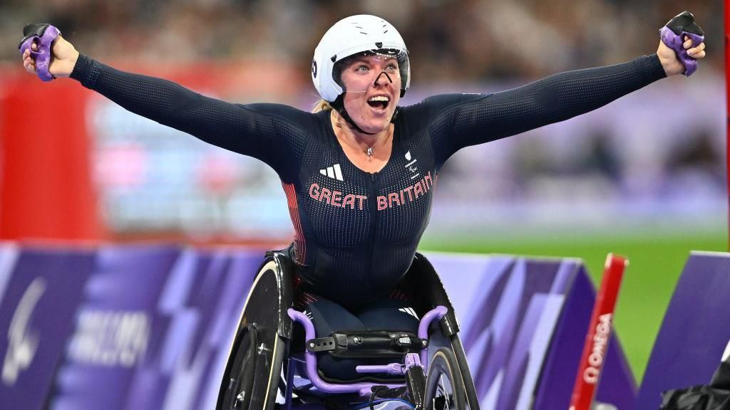 Hannah Cockroft celebrates as she crosses the line to win the T34 800m