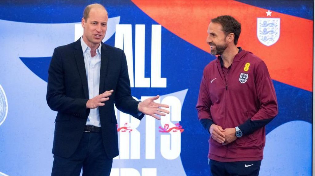 Prince William standing beside Gareth Southgate